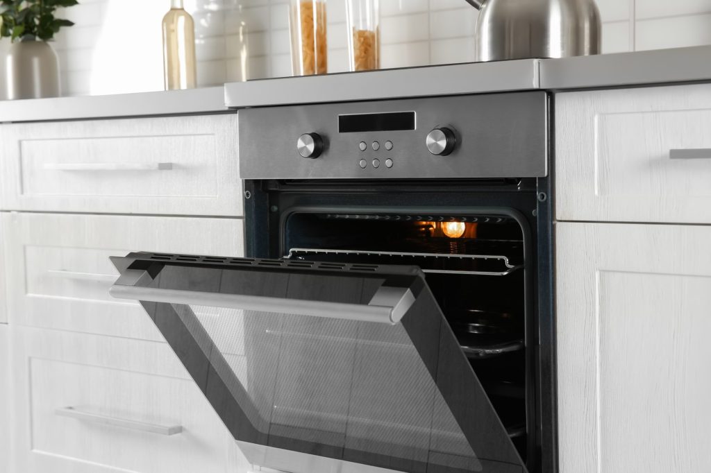 Open modern oven built in kitchen furniture